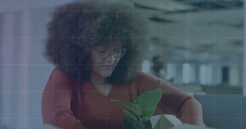 Businesswoman Analyzing Data in Modern Corporate Office