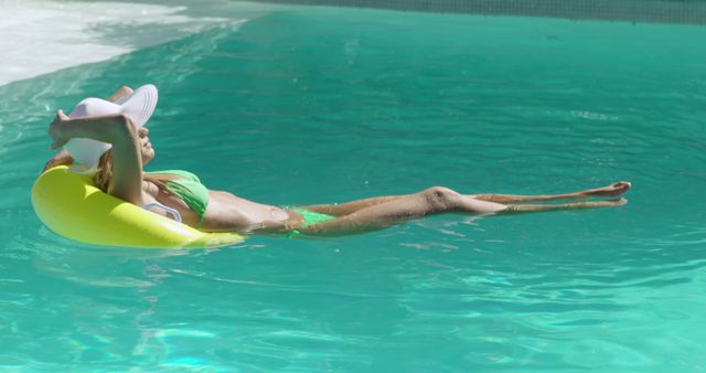 Woman Relaxing on Float in Pool Wearing Sun Hat - Download Free Stock Images Pikwizard.com