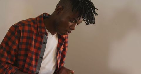 Focused Craftsman Preparing Leather Belt in Workshop