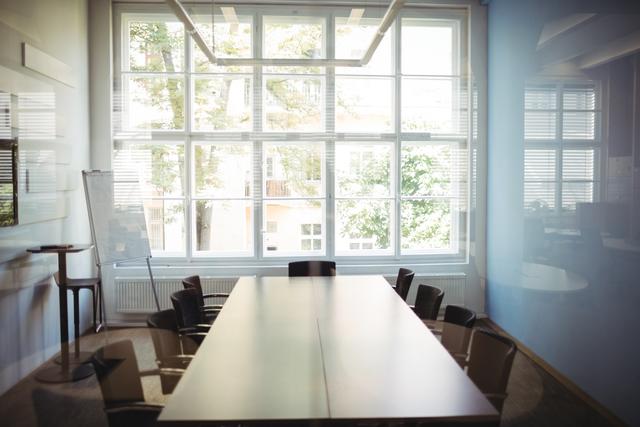 Empty Conference Room with Large Windows and Natural Light - Download Free Stock Photos Pikwizard.com