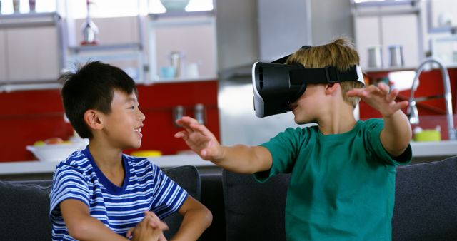 Two Boys Playing with Virtual Reality Headset in Modern Living Room - Download Free Stock Images Pikwizard.com