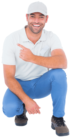Happy Man in Cap Kneeling and Pointing Transparently