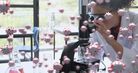 Scientist Examining Coronavirus Cells Using Microscope - Download Free Stock Images Pikwizard.com