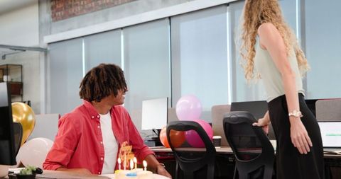 Joyful office birthday celebration with colleagues