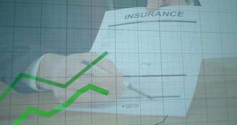 Business professional signing insurance document with financial graph overlay