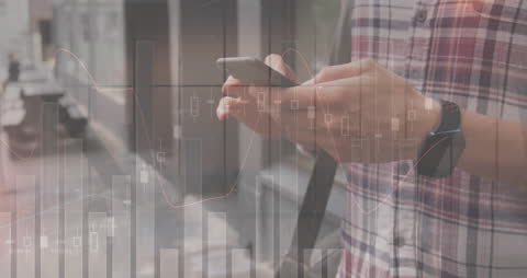 Hands of Man Using Smartphone with Financial Data Overlay