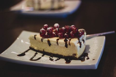 Gourmet Cheesecake with Red Berries and Chocolate Drizzle