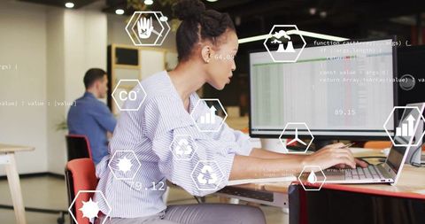 Diverse Colleagues Analyzing Data with Media Icons in Modern Office