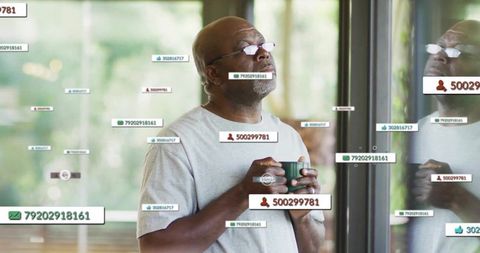 Senior Man Gazing with Coffee Amidst Digital Data Overlays
