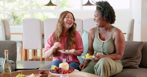 Friends Celebrating Birthday with Cake and Candles at Home