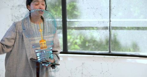 Asian woman presenting holographic 3d visualization with tablet at lectern in daylight