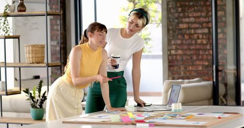 Successful Female Collaboration in Creative Loft Workspace