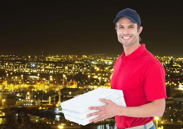 Digital composite of Happy deliveryman with pizza boxes in the city at night