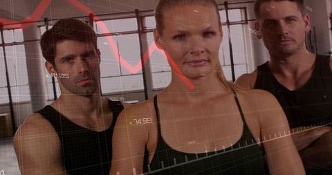 Serious fitness trio standing in industrial studio with performance data overlays