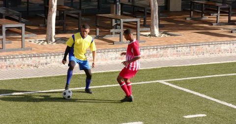 Two Youth Soccer Players Competing in Friendly Match