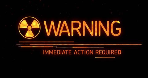 Digital warning message with nuclear symbol on black background