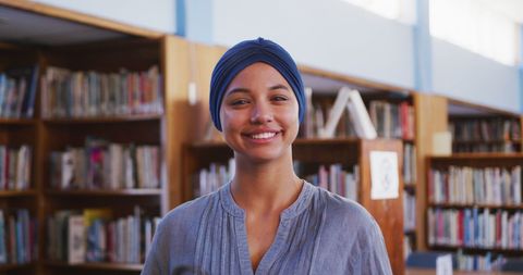 Smiling Biracial Female Student in Library - Download Free Stock Images Pikwizard.com
