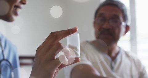 Doctor Presenting Medication to Patient in Consult