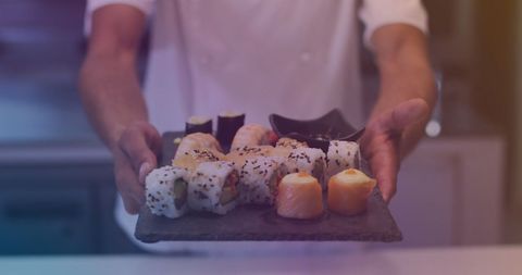 Chef Presenting Variety of Fresh Sushi in Kitchen - Download Free Stock Images Pikwizard.com
