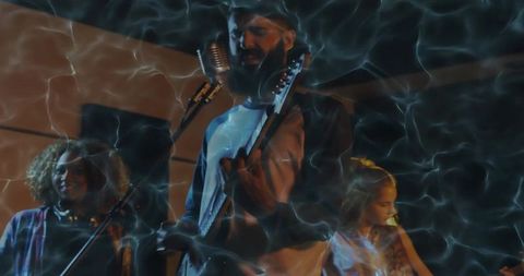 Dynamic Live Band Performance on Stage with Smoky Atmosphere