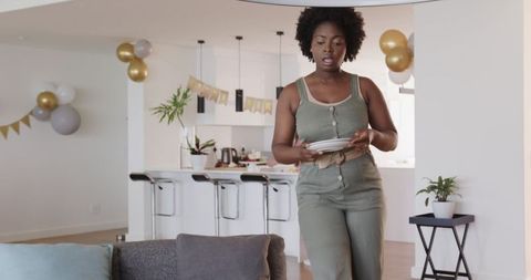 Preparing for birthday festivities in modern apartment