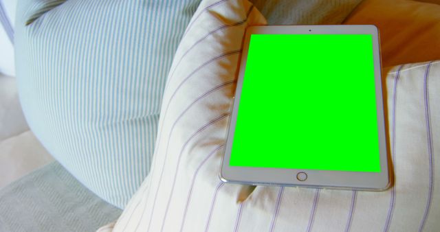 Digital Tablet with Green Screen on Cushions at Home - Download Free Stock Images Pikwizard.com