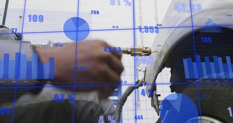 Technician tightening brass hose fitting on cylinder with blue analytics overlay