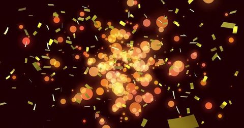 Spinning golden bokeh confetti burst with glowing orbs and metallic particle glow