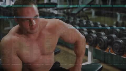 Bodybuilder Relaxing and Hydrating in Weightlifting Area