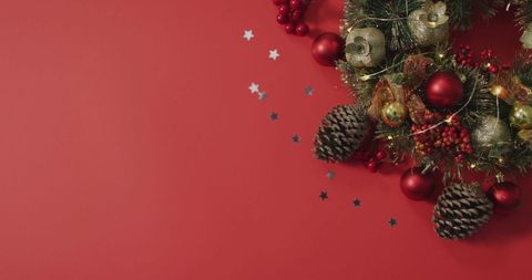 Festive Christmas Wreath with Pinecones and Red Background - Download Free Stock Images Pikwizard.com