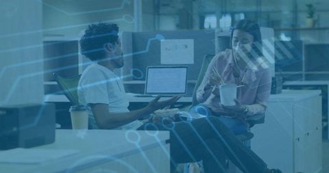 Colleagues Collaborating and Eating in Modern Open-Plan Office