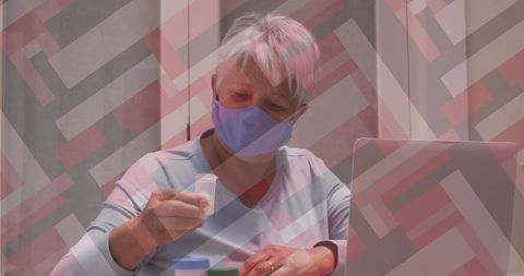 Senior Woman Managing Health at Home with Laptop Setup