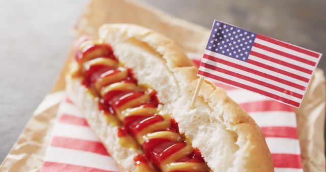 Image of hot dog with mustard and ketchup with flag of usa on a black surface - Download Free Stock Photos Pikwizard.com