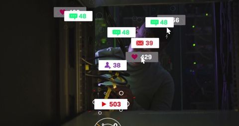 Technician managing server in data center with digital notifications