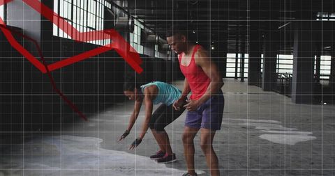 Urban training couple taking sprint start in loft, vibrant gear, gritty athletic motion
