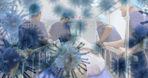 Medical team urgent care for covid-19 patient in hospital corridor