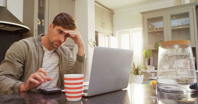 Stressed Young Man Working at Home in Modern Kitchen - Download Free Stock Images Pikwizard.com