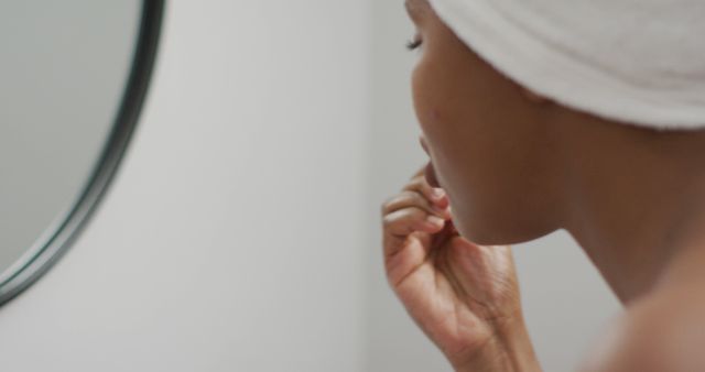 Woman Performing Skincare Routine in Bathroom - Download Free Stock Images Pikwizard.com