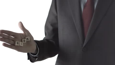 Businessman Dropping Risk Blocks Representing Uncertainty Management