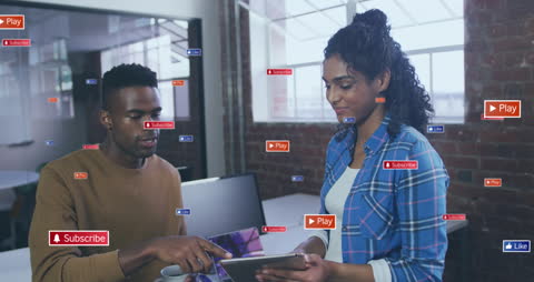 Diverse Team Engaging with Social Media Interface in Modern Office