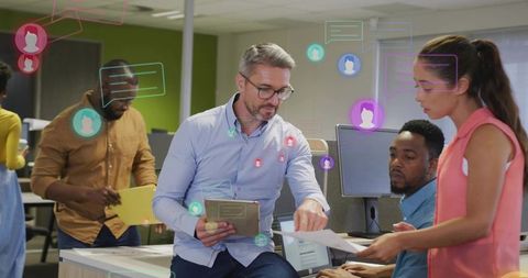 Manager pointing with tablet while team collaborating using augmented reality overlays