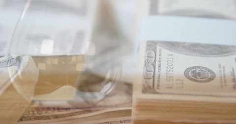Digital Business Concept with Banknotes and Hourglass Reflection - Download Free Stock Images Pikwizard.com