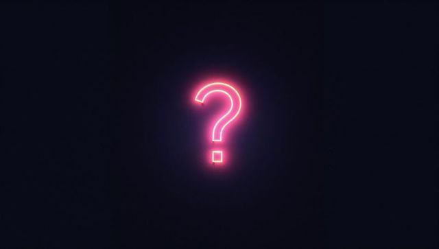 Neon question mark sign on dark background