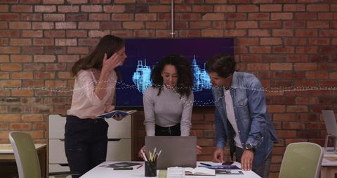 Diverse Team Collaborating on Digital Interface in Office