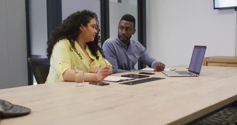Coworkers Collaborating in Modern Office Setting