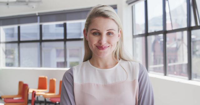 Confident Businesswoman in Modern Office with Bright Windows - Download Free Stock Images Pikwizard.com