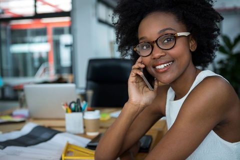 Confident Female Architect Collaborating in Contemporary Office Environment