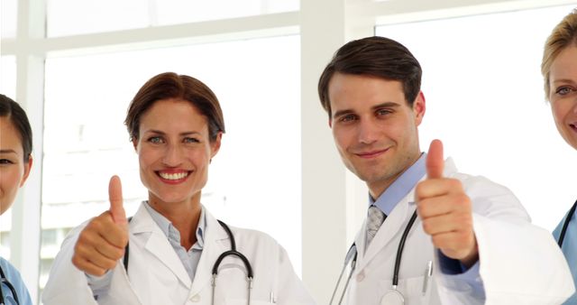 Medical team giving thumbs up to camera at the hospital - Download Free Stock Photos Pikwizard.com