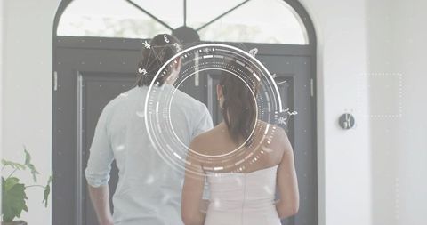 Smart home entry welcoming couple with futuristic hud overlay and modern double doors