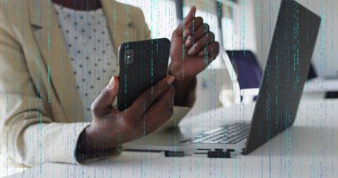Businesswoman Holding Smartphone Texting at Modern Minimalist Desk with Laptop, Pens